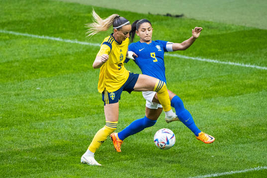 Kosovare Asllani of Sweden and Debinha of Brazil