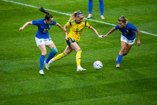 Luana and Tamires of Brazil compete for the ball with