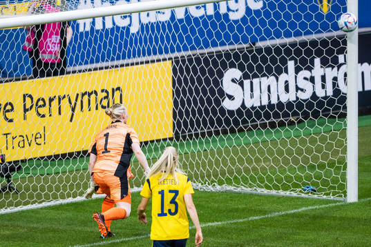 goalkeeper Hedvig Lindahl of Sweden sees the ball hit the