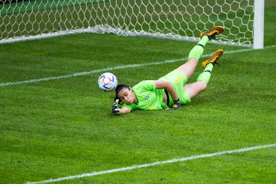 goalkeeper  Lorena of Brazil with a save