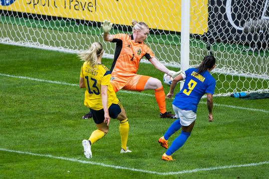 Debinha of Brazil scores 0-1 behind goalkeeper Hedvig