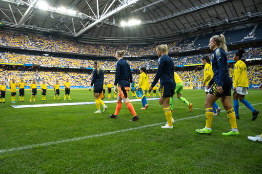 Players of Sweden enter the pitch