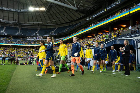 Players of Sweden enter the pitch