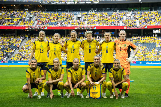 Players of Sweden pose for a photo