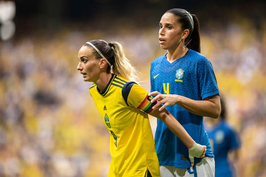 Kosovare Asllani of Sweden and Rafaelle of Brazil