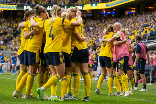 Caroline Seger and Magdalena Eriksson of Sweden celebrate