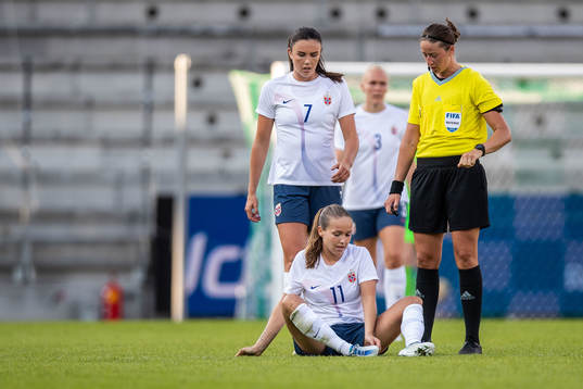 Ingid Systad Engen and Guro Reiten of Norway and referee