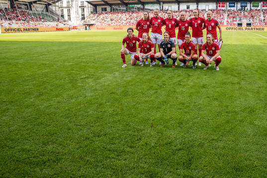 The players of Denmark pose for a photo