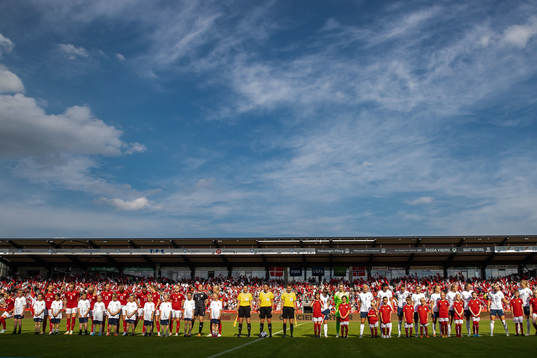 Players of Denmark and Norway with the referees