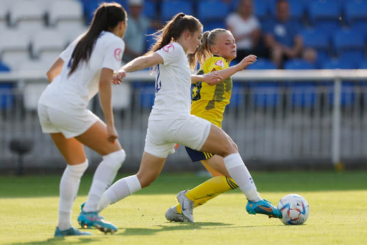 Matilda Nildén of Sweden in action against Tara Bourne and