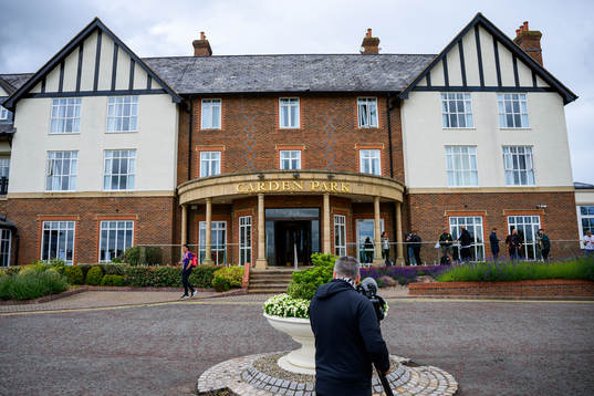 A photographer films an exterior shot of the Swedish
