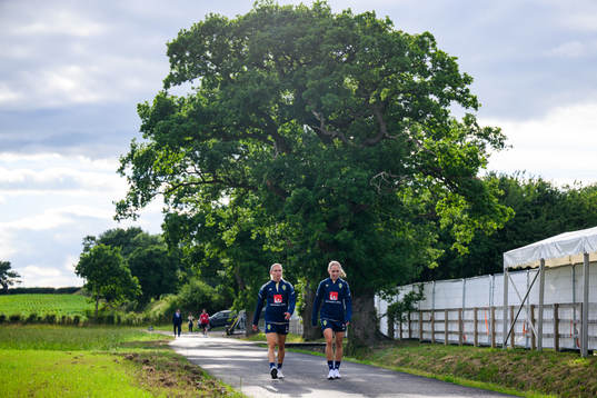 Jonna Andersson and Elin Rubensson walk bak from a training
