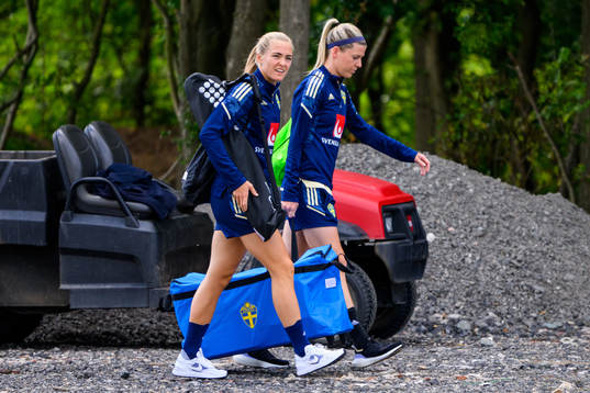 Magdalena Eriksson and Olivia Schough arrive for a training