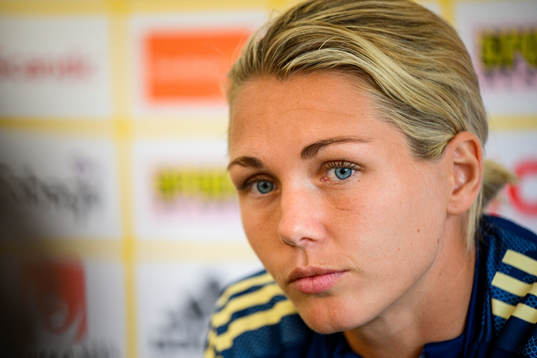 Goalkeeper Jennifer Falk is interviewed by the media