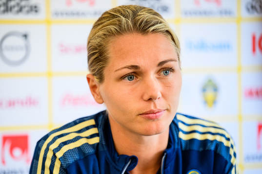 Goalkeeper Jennifer Falk is interviewed by the media