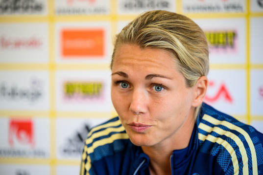 Goalkeeper Jennifer Falk is interviewed by the media