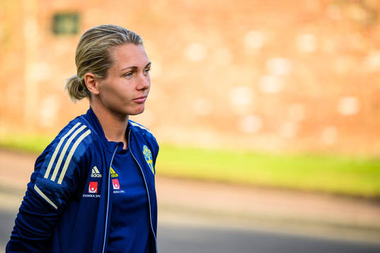 Goalkeeper Jennifer Falk is interviewed by the media
