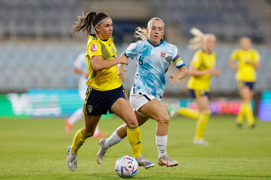 Emilia Pelganderof Sweden in action against Julie Jorde of