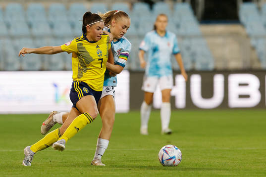 Emilia Pelganderof Sweden in action against Julie Jorde of