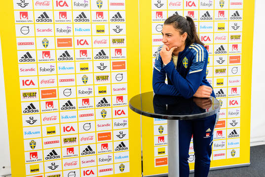 Goalkeeper Zecira Musovic is interviewed by the media