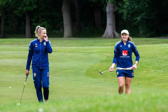 Fridolina Rolfö and Magdalena Eriksson of Sweden tees off