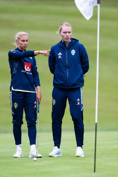 Jonna Andersson and goalkeeper Hedvig Lindahl of Sweden