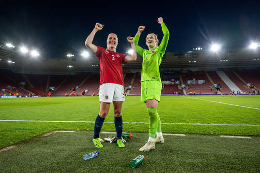 Maria Thorisdottir and goalkeeper Guro Pettersen of Norway