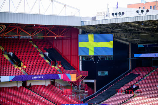 Interior view of Bramall Lane with a monitor showing a
