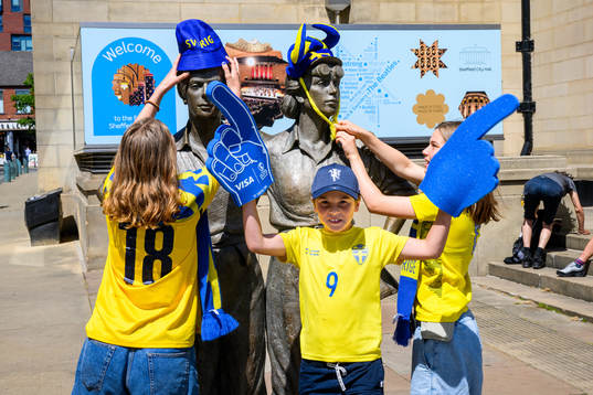 Supporters of Sweden put fan merchandise