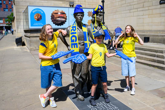 Supporters of Sweden put fan merchandise