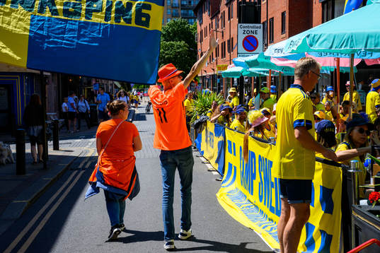 A Dutch supporter walks past Camp Sweden gather sport Frog