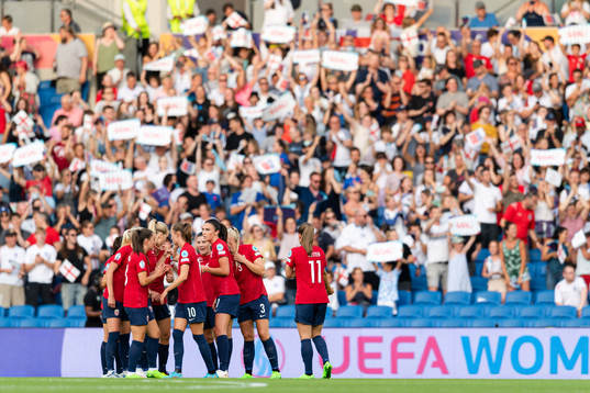 Ingrid Syrstad Engen of Norway with teammates look dejected