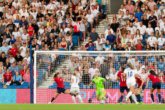 Beth Mead of England scores the 5-0 goal behind Maren