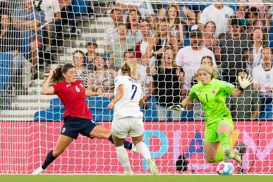 Beth Mead of England scores the 5-0 goal behind Maren