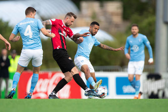 Niklas Moisander and Sergio Pena of Malmö FF and Nikolaj