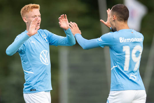 Hugo Larsson and Veljko Birmancevic of Malmö FF celebrate