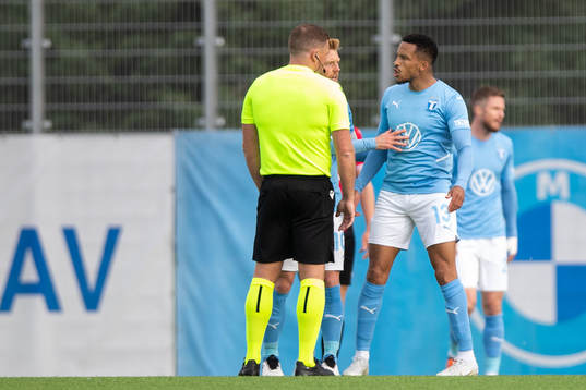 Martin Olsson of Malmö FF reacts to referee John Beaton
