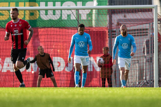 Martin Olsson and Jo Inge Berget of Malmö FF looks dejected