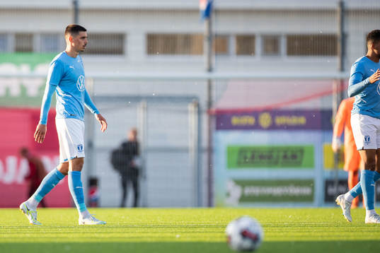 Dennis Hadzikadunic of Malmö FF looks dejected