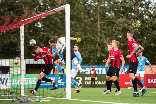 Halldor Smari Sigurdsson and goalkeeper Ingvar Jonsson of