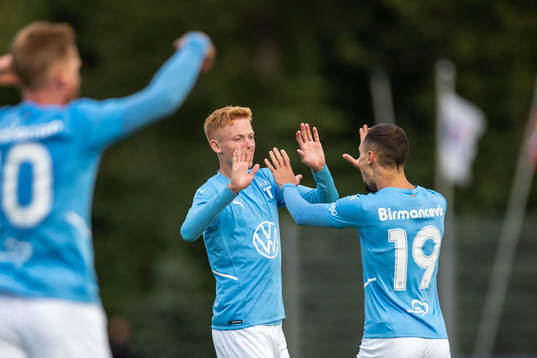 Hugo Larsson and Veljko Birmancevic of Malmö FF celebrate