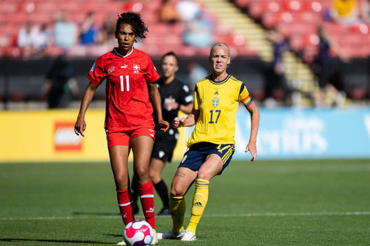 Coumba Sow of Switzerland and Caroline Seger of Sweden