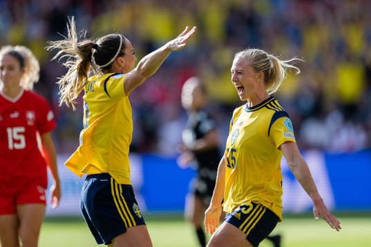 Kosovare Asllani and Rebecka Blomqvist of Sweden celebrate