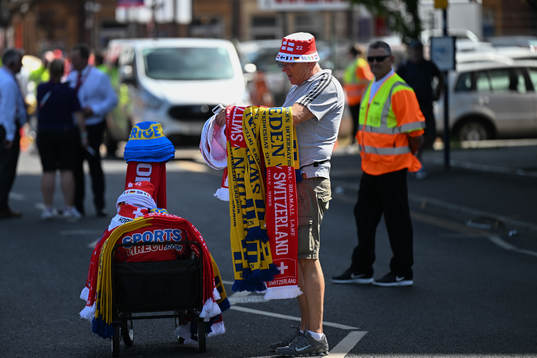 A vender selling scarves