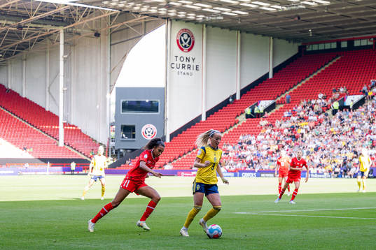 Coumba Sow of Switzerland and Kosovare Asllani of Sweden