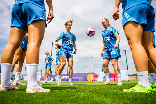Tuva Hansen and goalkeeper Aurora Mikalsen of the Norwegian