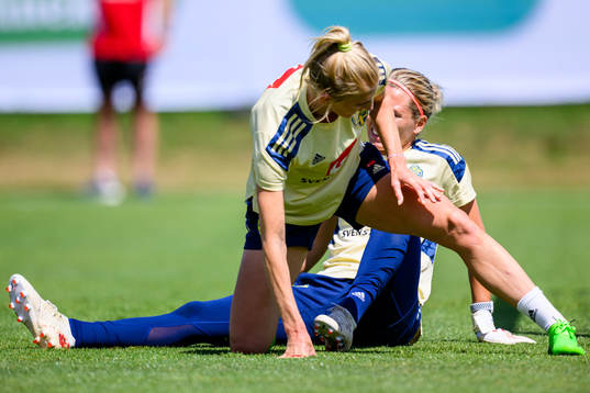 Sofia Jakobsson and goalkeeper Jennifer Falk of the Swedish