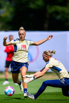Hanna Bennison and goalkeeper Jennifer Falk of the Swedish