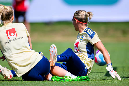 Sofia Jakobsson and goalkeeper Jennifer Falk of the Swedish