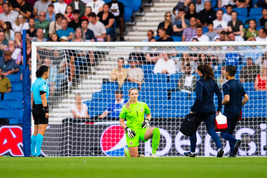 Goalkeeper Guro Pettersen of Norway receive medical